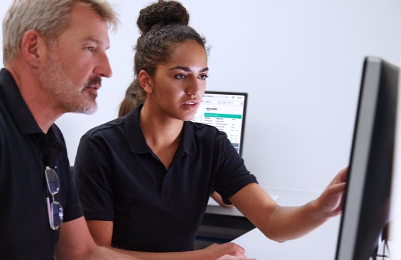 Man and woman using computer